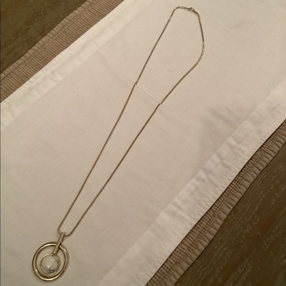Circle design on a long gold toned snake chain. - Picture 2 of 2
